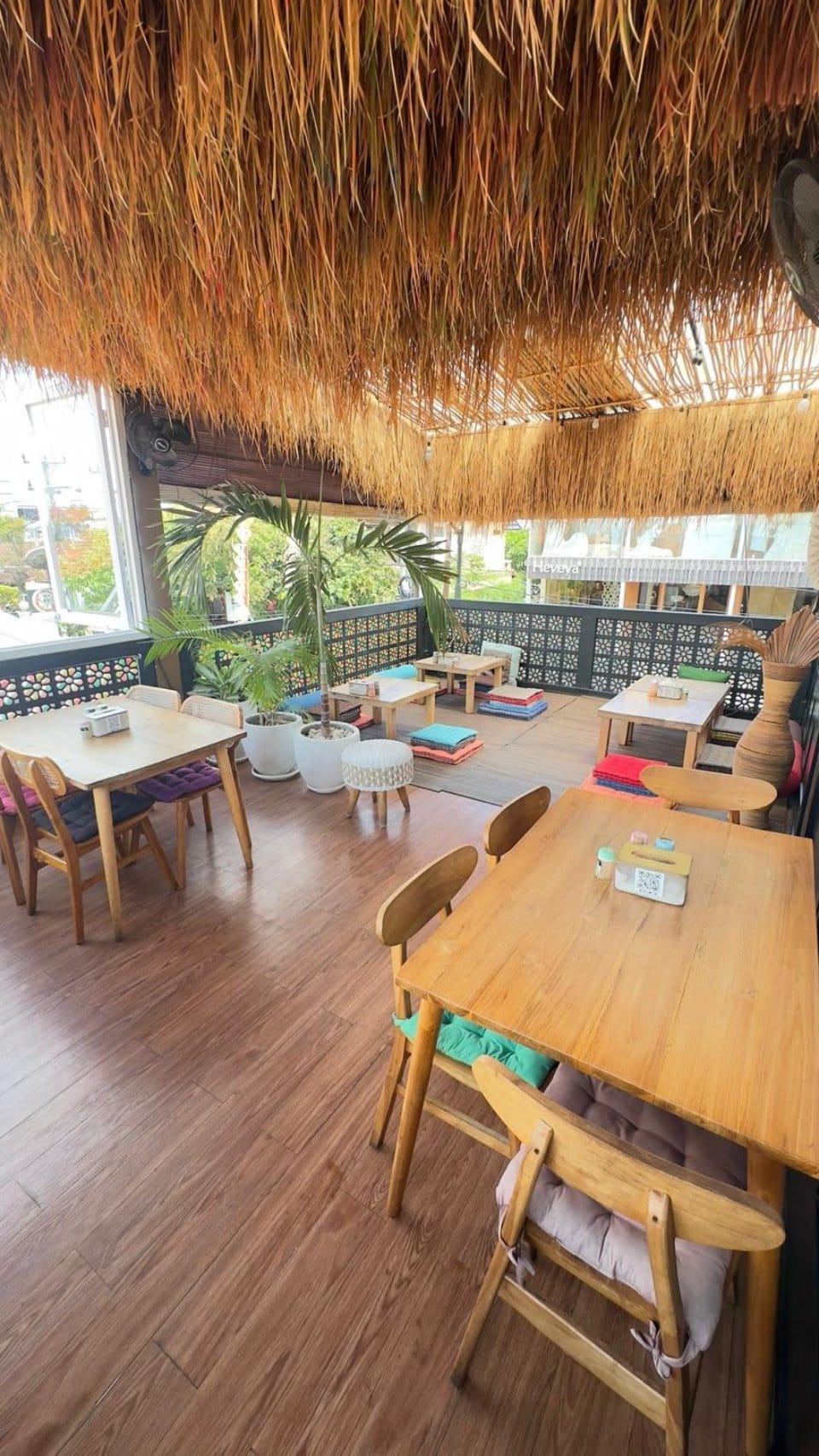 Wooden boho seating area inside Slavic Roots Cafe & Eatery in Berawa, Canggu, Bali