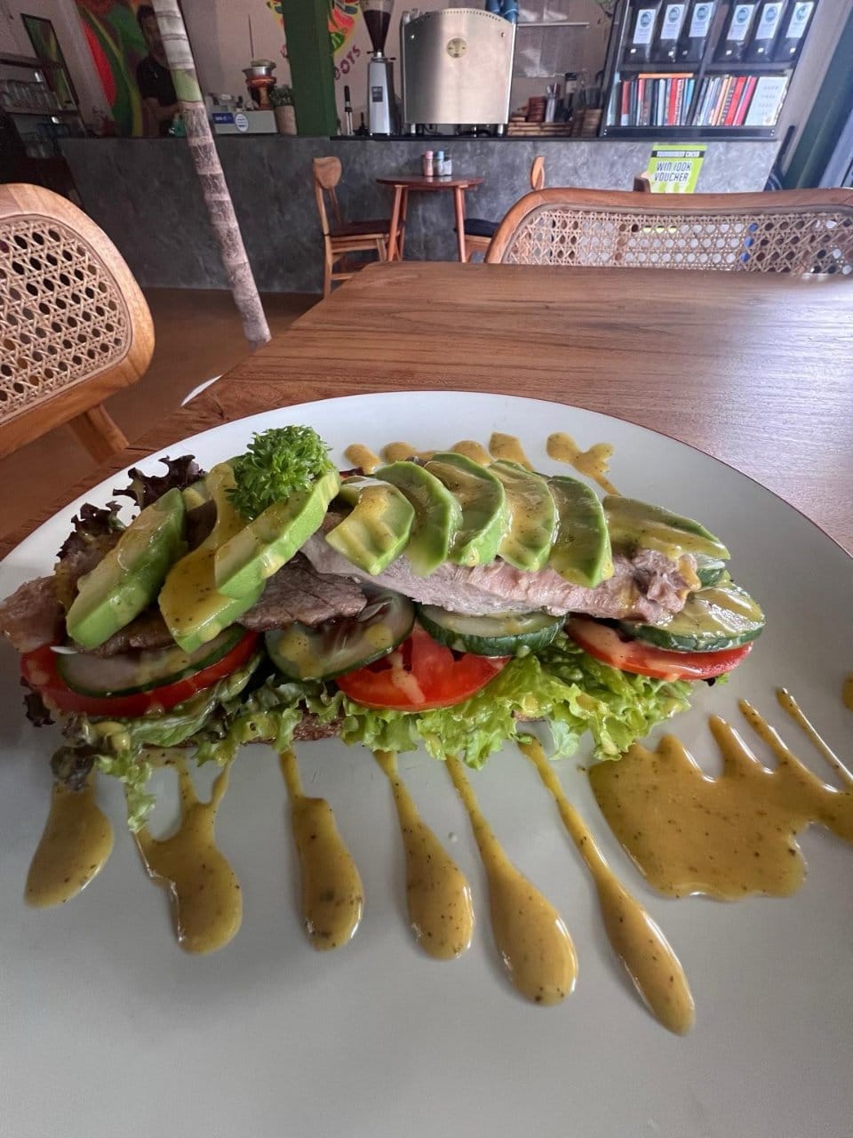 Fresh organic beef and avocado sandwich served for lunch at Slavic Roots Cafe & Eatery in Berawa Canggu, Bali