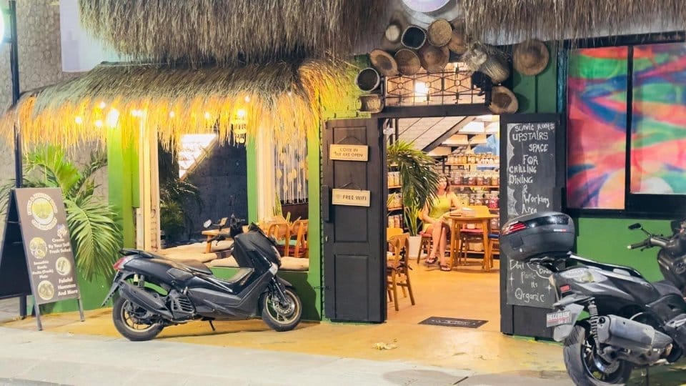 Cafe entrance at night at Slavic Roots Cafe & Eatery on Jl. Pantai Berawa, Canggu, Bali